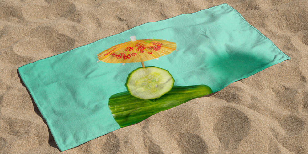 Tropical beach concept made of cucumber and sun umbrella, 
