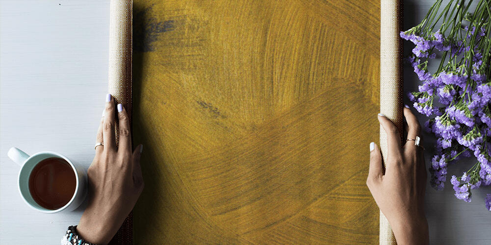 different golden brushstrokes on dark textured background, 