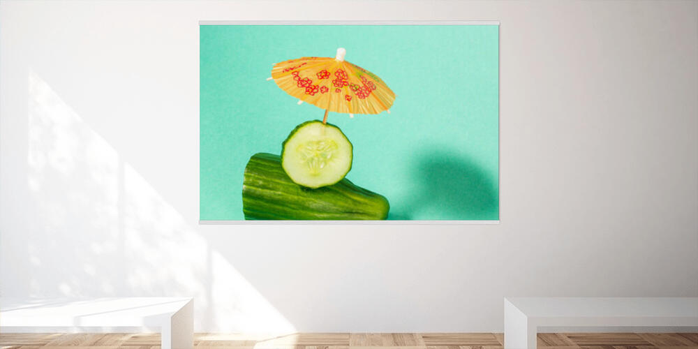 Tropical beach concept made of cucumber and sun umbrella, 