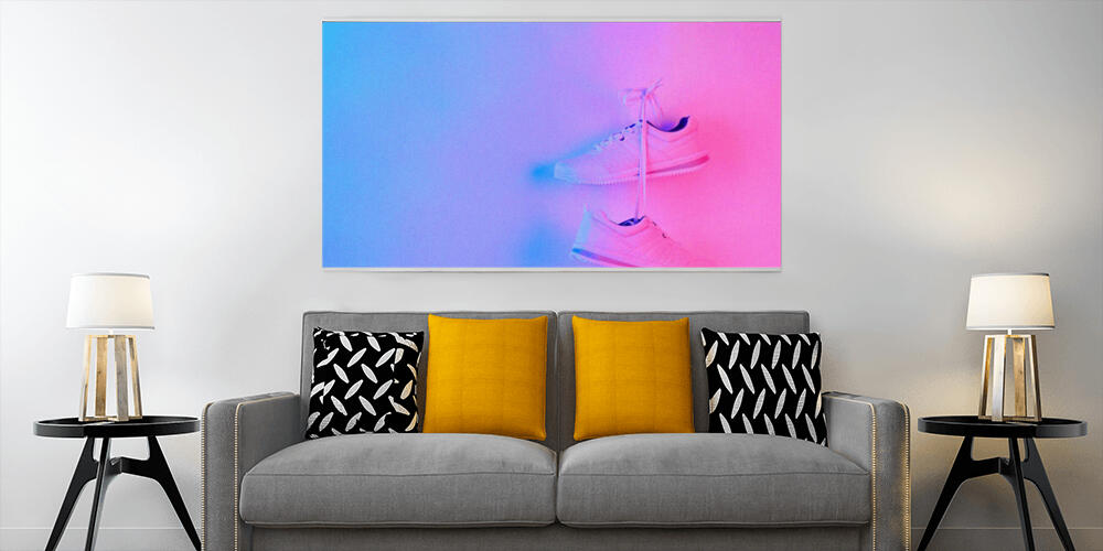Pair of stylish sneakers hanging on wall, 