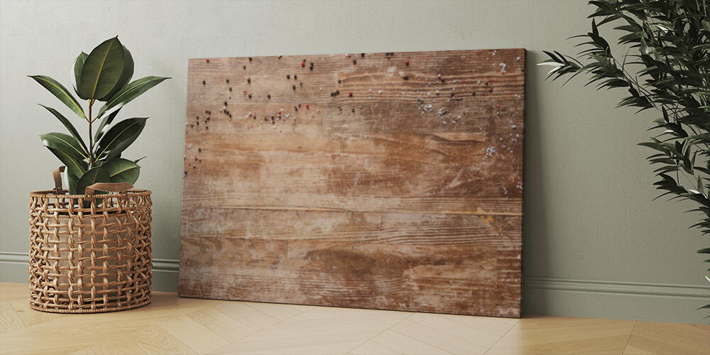 top view of vintage wooden table with scattered peppercorns, 