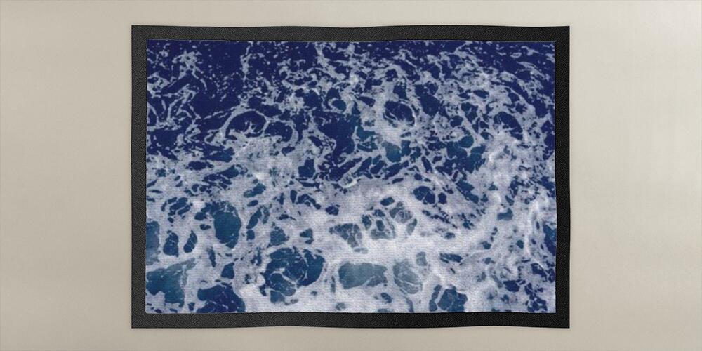 abstract texture of sea white foam on a blue background of sea water, 